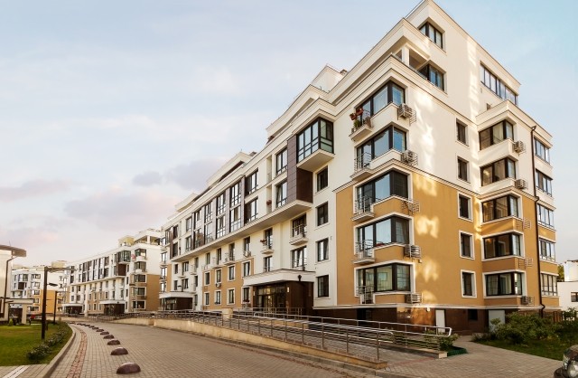 Real estate low rise construction building exterior in new residential area